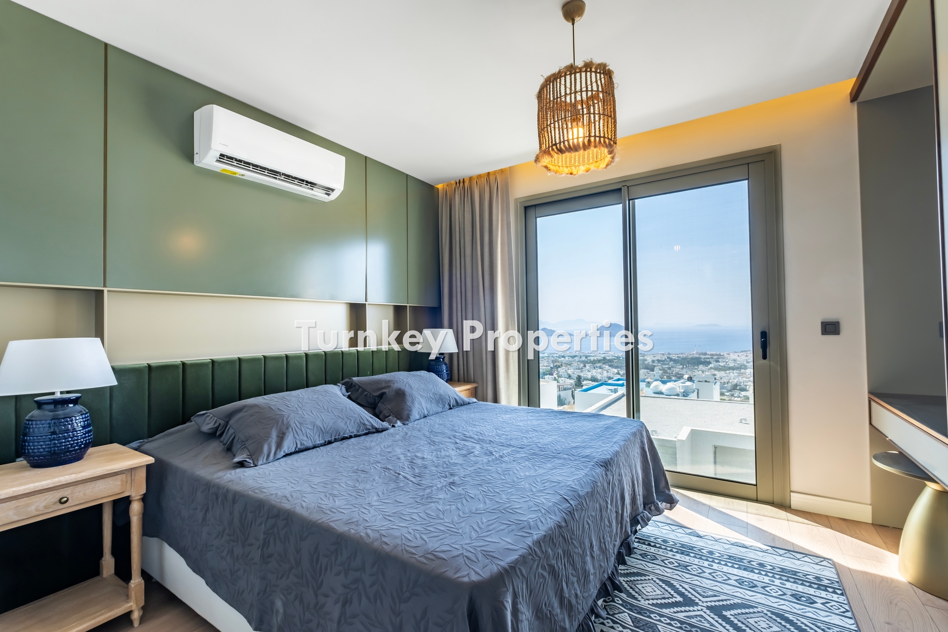 2+1 Apartment for Sale in Turgutreis with Marina and Kalymnos Views | Shared Pool, Underfloor Heating, Water Tank, and Generator Facilities