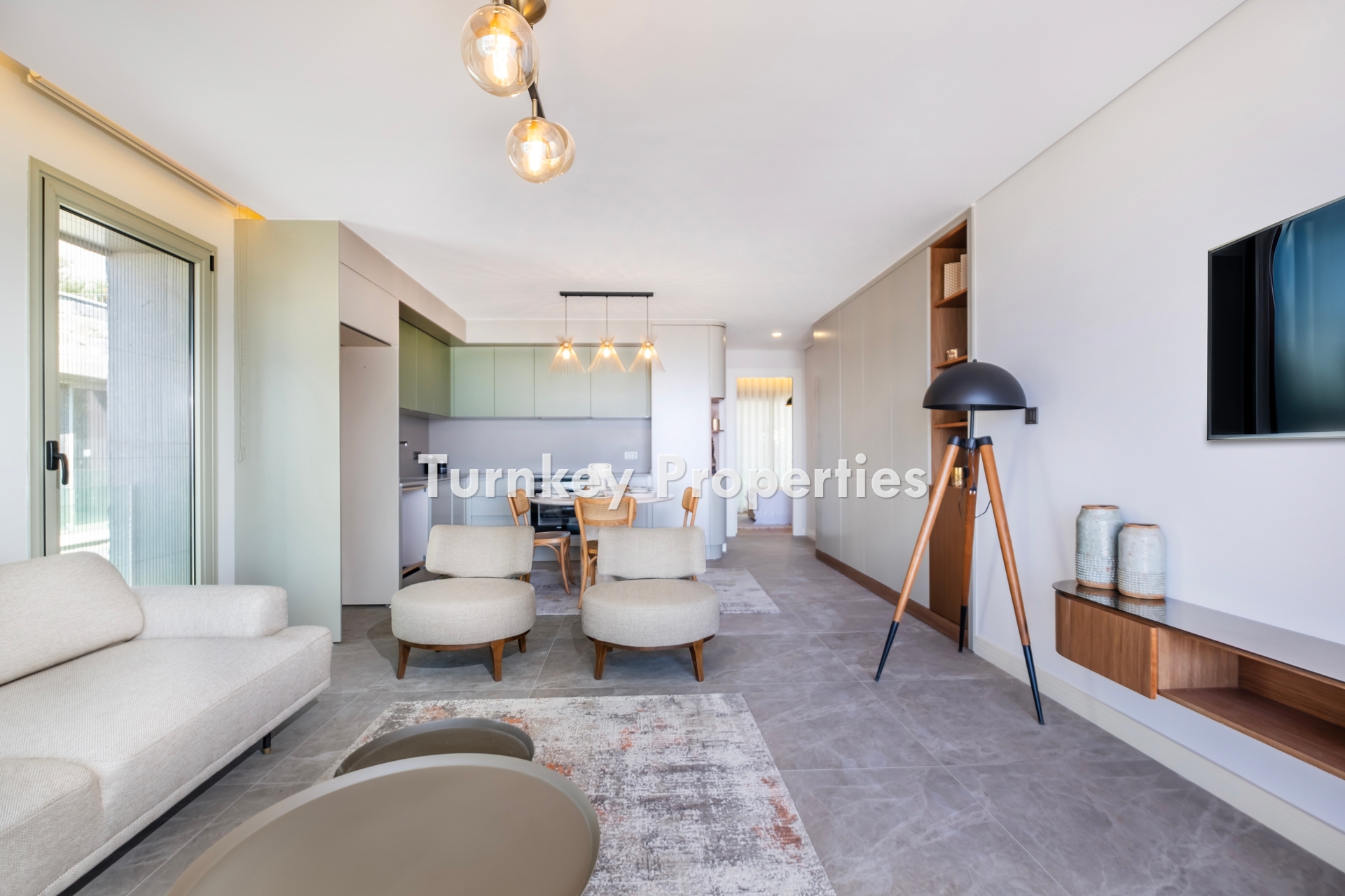 2+1 Apartment for Sale in Turgutreis with Marina and Kalymnos Views | Shared Pool, Underfloor Heating, Water Tank, and Generator Facilities