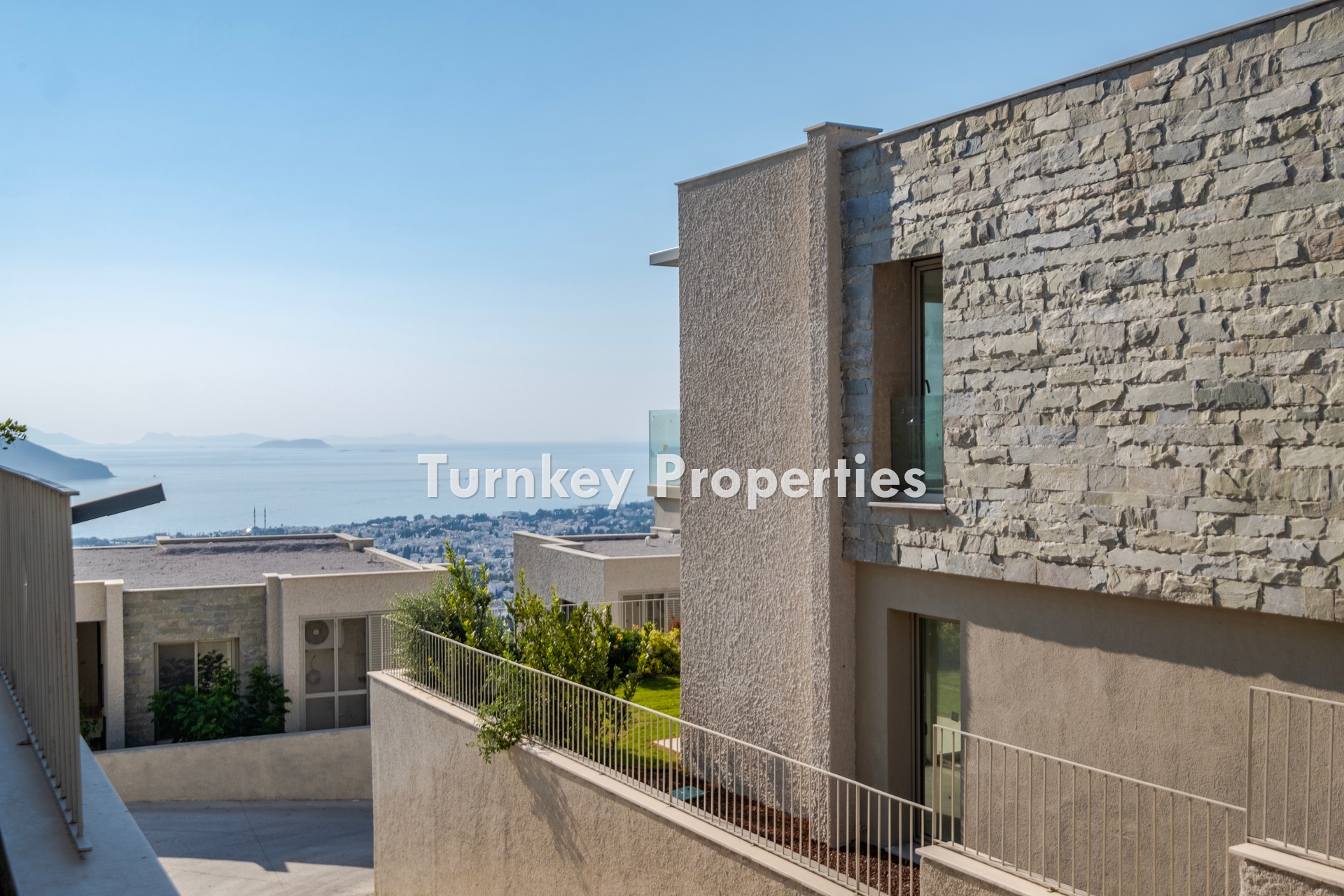 2+1 Apartment for Sale in Turgutreis with Marina and Kalymnos Views | Shared Pool, Underfloor Heating, Water Tank, and Generator Facilities